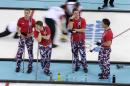 Norway player, from left, Haavard Vad Petersson, Torger Nergaard, Christoffer Svae, and skip Thomas Ulsrud wait for their turn to throw during men's curling competition against Denmark at the 2014 Winter Olympics, Monday, Feb. 17, 2014, in Sochi, Russia. (AP Photo/Robert F. Bukaty)