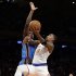 New York Knicks' J.R. Smith (8) drives past Oklahoma City Thunder's Serge Ibaka during the first half of an NBA basketball game Thursday, March 7, 2013, in New York.  (AP Photo/Frank Franklin II)
