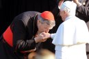 Australia's Cardinal George Pell kissed the hand of Pope Benedict XVI at Government House in Sydney, July 17, 2008