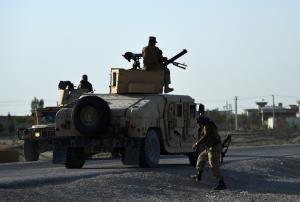 Afghan military personnel stand guard near the airport&nbsp;&hellip;