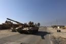 A tank of Iraqi security forces is seen in the town of al-Alam