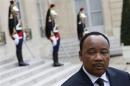 Niger's President Issoufou talks to journalists after a meeting with French President at the Elysee Palace in Paris