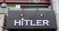 A security guard looks on from the roof of the 'Hitler' clothing store in Ahmedabad on August 28. Members of the Jewish community in the western Indian state have urged the shop owners to change the name of the store, which was opened on August 19