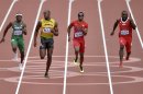 Nigeria's Noah Akwu, left, Jamaica's Usain Bolt, second left, United States' Isiah Young, second right, and Switzerland's Alex Wilson, right, compete in a men's 200-meter heat during the athletics in the Olympic Stadium at the 2012 Summer Olympics, London, Tuesday, Aug. 7, 2012.(AP Photo/Martin Meissner)