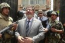 Islamic presidential candidate Mohamed Mursi arrives to a polling station to cast his vote in Al-Sharqya