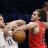 Chicago Bulls center Joakim Noah (13) steals the ball from Brooklyn Nets center Brook Lopez (11) in the first half of Game 5 of their first-round NBA basketball playoff series, Monday, April 29, 2013, in New York. (AP Photo/Kathy Willens)