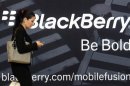 File photo of a woman using her mobile phone at the Blackberry World Event in Orlando
