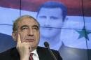 Jamil, Syria's deputy prime minister for economic affairs, listens during a news conference in Moscow