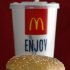 FILE - In this file photo taken Dec. 29, 2009, the McDonald's iconic Big Mac sandwich is displayed in front of one of the drinks served in a McDonald's restaurant in North Huntinton, Pa. The way Americans are chomping Big Macs, lacing up Air Jordans and gulping peppermint mochas in this abysmal economy, you’d think they’re taking advantage of big holiday discounts. (AP Photo/Keith Srakocic, File)