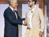 Robson Walton, left, chairman of the board of directors of Walmart Stores Inc. and son of the late Walmart founder Sam Walton, shakes hands with actor Justin Timberlake, right, during the Walmart shareholders' meeting in Fayetteville, Ark., Friday, June 1, 2012. (AP Photo/April L. Brown)