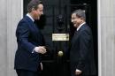 Britain's Prime Minister David Cameron, left, welcomes Prime Minister of Turkey Ahmet Davutoglu to 10 Downing Street, in London, Monday, Jan. 18, 2016. (AP Photo/Kirsty Wigglesworth)