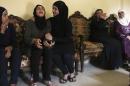 Wife of Lebanese soldier Ali al-Sayyed, who was beheaded by Islamic State militants, mourns with relatives in the town of Fnideq, northern Lebanon