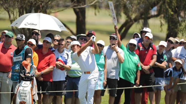 This handout photo taken and received from OneAsia on November 9, 2013 shows Rickie Fowler of the US playing a shot during the third round of the Australian PGA Championship at the RACV Royal Pines Resort golf club on Australia’s Gold Coast