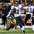 Baltimore Ravens' Jacoby Jones (12) returns a punt past Pittsburgh Steelers' Baron Batch (20) on his way to a touchdown in the first quarter of an NFL football game, Sunday, Nov. 18, 2012, in Pittsburgh. (AP Photo/Don Wright)
