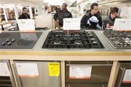 Shoppers look at appliances at a Home Depot store in New York December 23, 2009. REUTERS/Lucas Jackson
