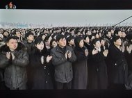 North Koreans can be seen applauding during a ceremony marking the first anniversary of the death of Kim Jong-Il in this screen grab taken from North Korean TV on December 17, 2012. The mass crowd listened to a speech extolling the late Kim's virtues delivered from a balcony