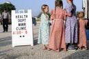 In this June 25, 2014 photo, young Mennonite girls gather at the health and safety clinic, which included a Measles, Mumps, & Rubella vaccinations in Shiloh, Ohio. Health officials said Ohio’s current outbreak of measles consists of more than 360 cases and is the biggest in the U.S. since 1994. The outbreak started after Amish travelers to the Philippines contracted measles this year and returned home to rural Knox County Ohio. (AP Photo/Tom E. Puskar)