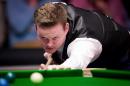 England's Shaun Murphy plays a shot during his quarter-final match against Marco Fu of Hong Kong during the Masters Snooker tournament at Alexandra Palace in London, on January 16, 2014