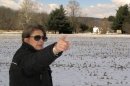 In this photo made on Tuesday, March 26, 2013, Carol Tanzola, president of Friends of Camp Security, points out the property on a 47-acre parcel, located about four miles east of York, Pa. It includes the spot where a 1979 archaeological study found numerous artifacts that confirmed local lore that the area had once served as Camp Security, a prison for the English, Scottish and Canadian soldiers who were captured after defeats in the battles of Saratoga and Yorktown. (AP Photo/Mark Scolforo)
