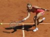 Azarenka of Belarus returns the ball to Pfizenmaier of Germany during the French Open tennis tournament at the Roland Garros stadium in Paris