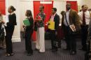 Attendees line up for a job interview at a job fair in Washington