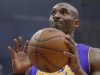 Los Angeles Lakers guard Kobe Bryant reacts during the first half of their NBA basketball game against the Los Angeles Clippers, Friday, Jan. 4, 2013, in Los Angeles.  (AP Photo/Mark J. Terrill)