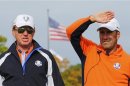 European team captain Olazabal watches practice round play with vice captain and compatriot Jimenez at the 39th Ryder Cup golf matches at the Medinah Country Club