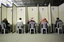 Ennahda party members fill up their ballot papers during the election of the new leadership of Ennahda in Tunis