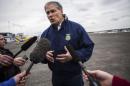 Washington Governor Inslee talks to reporters about ongoing recovery operations for the Oso mudslide, at the Arlington Municipal Airport in Arlington