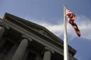 A US flag flies outside the U.S. Department of Justice building in Washington