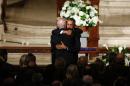 US President Barack Obama (R) hugs Vice President Joe Biden during funeral services for Beau Biden at St. Anthony of Padua Church in Wilmington, Delaware, on June 6, 2015