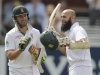 South Africa's Hashim Amla celebrates reaching his century as he is watched by teammate AB de Villiers during the third cricket test match at Lord's in London