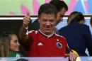 Colombia President Juan Manuel Santos gives a thumbs up during the 2014 World Cup quarter-finals between Brazil and Colombia at the Castelao arena