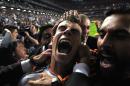 Real Madrid's Gareth Bale celebrates with teammates after scoring his side's second goal in the Champions League final soccer match against Atletico Madrid at the Luz Stadium in Lisbon, Portugal, Saturday, May 24, 2014. Real Madrid won 4-1 in extra time. (AP Photo/Manu Fernandez)