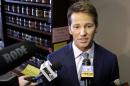 FILE - In this Feb. 6, 2015 file photo, Rep. Aaron Schock, R-Ill., speaks to reporters in Peoria, Ill. Schock spent taxpayer and campaign funds on private airplanes to fly him around the country on aircraft owned by some of his key donors, The Associated Press has found. The expenses coincide with his other high-figure entertainment and travel charges. Beyond air travel, Schock spent tens of thousands more on tickets for concerts and billed car mileage reimbursements among the highest in Congress. One venue included a sold-out Katy Perry concert in Washington last June with Schock and his interns. (AP Photo/Seth Perlman, File)