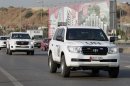 The convoy of a U.N. team of weapons inspectors, who concluded its almost week-long mission in Syria, arrive at Rafik Hariri international airport in Beirut, Lebanon, Monday, Sept. 30, 2013. The inquiry determined that the nerve agent sarin was used in the Aug. 21 attack on a Damascus suburb in Syria, but it did not assess who was behind it. (AP Photo/Bilal Hussein)