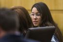 Jodi Arias looks at her defense attorney Jennifer Willmott during a hearing in Maricopa County Superior Court in Phoenix