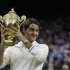 Roger Federer of Switzerland celebrates with the trophy after winning the men's singles final against Andy Murray of Britain at the All England Lawn Tennis Championships at Wimbledon, England, Sunday, July 8, 2012. (AP Photo/Kirsty Wigglesworth)