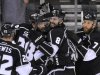 Los Angeles Kings defenseman Drew Doughty (8) celebrates with teammates center Trevor Lewis (22), center Jarret Stoll (28) and defenseman Rob Scuderi after they won Game 3 of the NHL hockey Stanley Cup Western Conference finals, Thursday, May 17, 2012, in Los Angeles. The Kings won 2-1. (AP Photo/Mark J. Terrill)