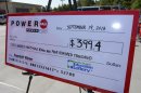 A giant check is displayed announcing a winner in the Powerball outside Murphy Express store on Thursday, Sept. 19, 2013 in Lexington, S.C. A $400 million winning ticket in the latest Powerball drawing was sold at the service station just off I-20 west of Columbia, officials with the South Carolina Education Lottery said Thursday. Winners in South Carolina do not have to come forward publicly but Lottery Executive Director Paula Harper Bethea noted that, in order to claim the winnings, the ticketholder must contact state lottery officials within 180 days. (AP Photo/ Richard Shiro)