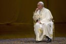 Pope Francis sits on stage during a meeting at the Rio de Janeiro Municipal Theater in Rio de Janeiro, Brazil, Saturday, July 27, 2013. Francis was at Rio's municipal theater to meet with Brazilian politicians, businessmen, intellectuals and the diplomatic community. (AP Photo/Domenico Stinellis)