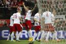 Poland's Arkadiusz Milik, right, celebrates with this teammates after scoring the opening goal during a Euro 2016 group D qualifying soccer match between Poland and Germany in Warsaw, Poland,Saturday, Oct. 11, 2014. (AP Photo/Czarek Sokolowski)