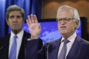 Ambassador Martin Indyk speaks to the media next to U.S. Secretary of State John Kerry at the State Department in Washington