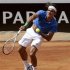 Federer of Switzerland serves the ball to Berlocq of Argentina during their men's singles match at the Rome Masters tennis tournament