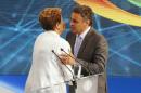 Brazil's presidential candidates Neves of Brazilian Social Democratic Party greets Rousseff of Workers Party after television debate at Bandeirantes TV studio in Sao Paulo