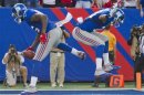 New York Giants Martellus Bennett celebrates touchdown pass against Tampa Bay Buccaneers with Ramses Barden in NFL game in East Rutherford