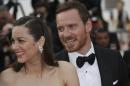 Marion Cotillard and Michael Fassbender pose for photographers upon arrival for the screening of the film Macbeth at the 68th international film festival, Cannes, southern France, Saturday, May 23, 2015. (Photo by Joel Ryan/Invision/AP)