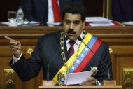 Venezuelan President Nicolas Maduro addresses lawmakers during the presentation of his annual state of the nation at the National Assembly in Caracas January 15, 2014. REUTERS/Carlos Garcia Rawlins
