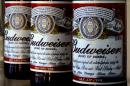FILE - This Jan. 27, 2009 file photo shows bottles of Budweiser beer at the Stag Brewery in London. According to Euromonitor, Anheuser-Busch InBev NV, the world's largest brewer, has a 21-percent share of the global beer market. (AP Photo/Kirsty Wigglesworth, File)