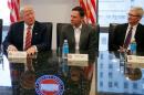 U.S. President-elect Donald Trump speaks while PayPal co-founder and Facebook board member Peter Thiel and Apple Inc CEO Tim Cook look on during a meeting with technology leaders at Trump Tower in New York